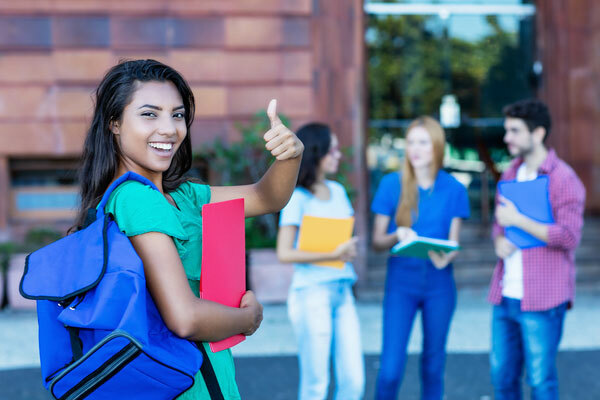 Successful Latin American Female Student with Group of Students Outdoor in the Summer in the City - JA of Norcal